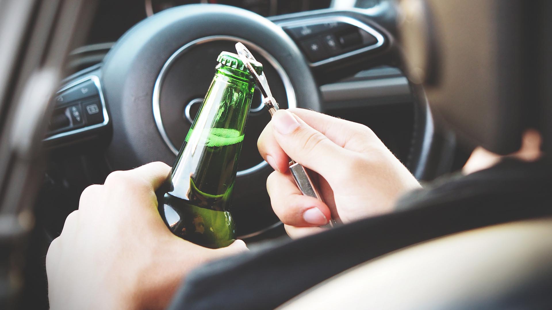opening a beer while driving