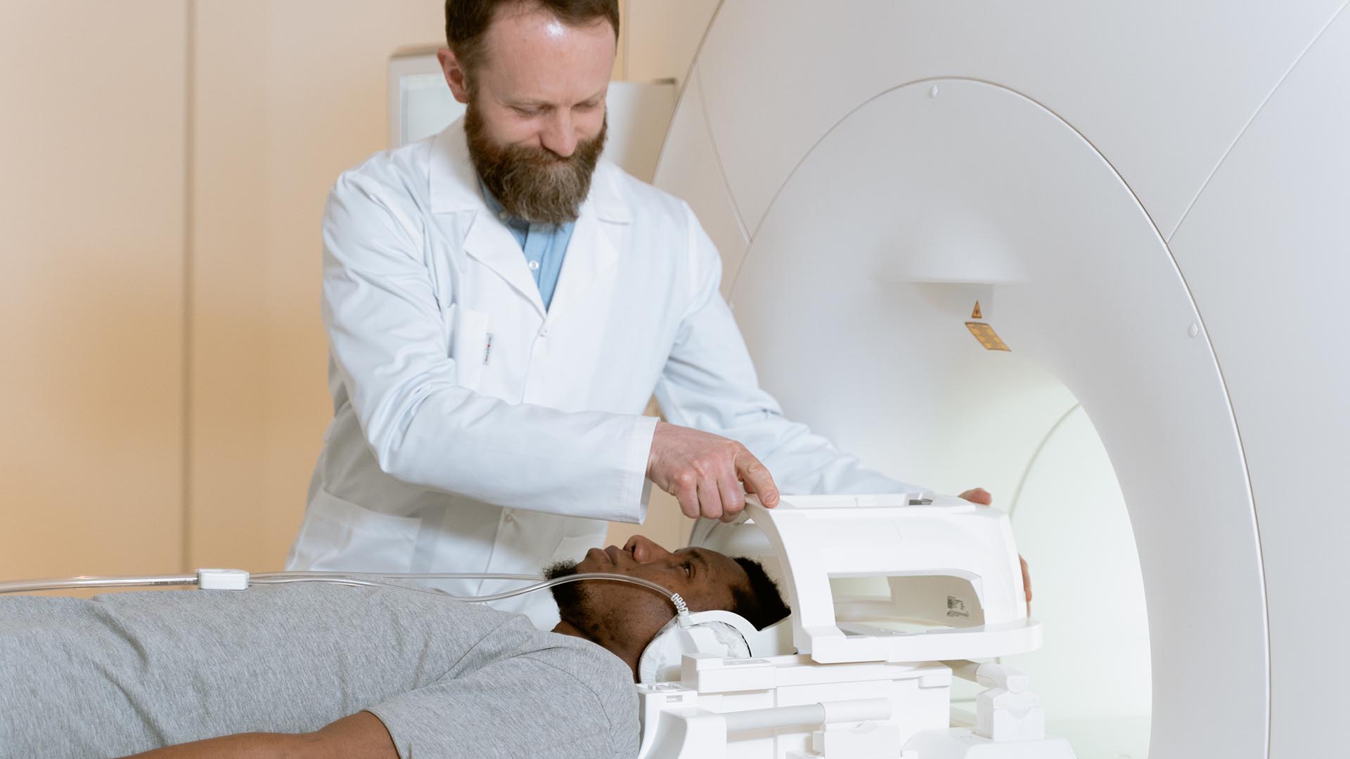 doctor setting up MRI machine